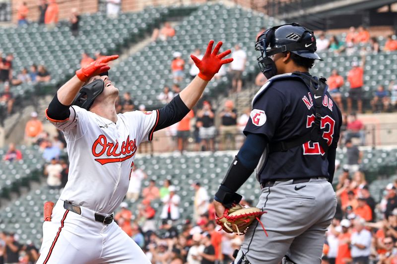 Jun 25, 2024; Baltimore, Maryland, USA; Baltimore Orioles shortstop Gunnar Henderson (2) reacts after hitting a first inning home run as Cleveland Guardians catcher Bo Naylor (23) looks on at Oriole Park at Camden Yards. Mandatory Credit: Tommy Gilligan-USA TODAY Sports