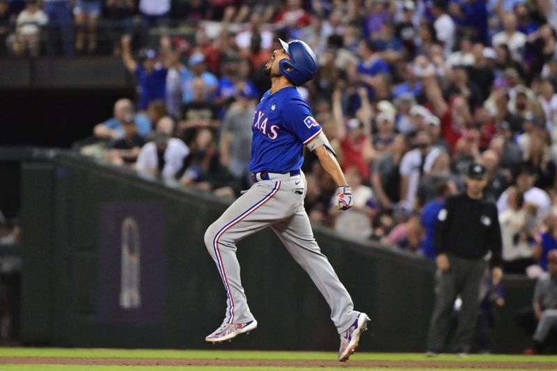 Nov 1, 2023; Phoenix, AZ, USA; Texas Rangers second baseman Marcus Semien (2) runs the bases in the ninth inning against the Arizona Diamondbacks in game five of the 2023 World Series at Chase Field. Mandatory Credit: Matt Kartozian-USA TODAY Sports