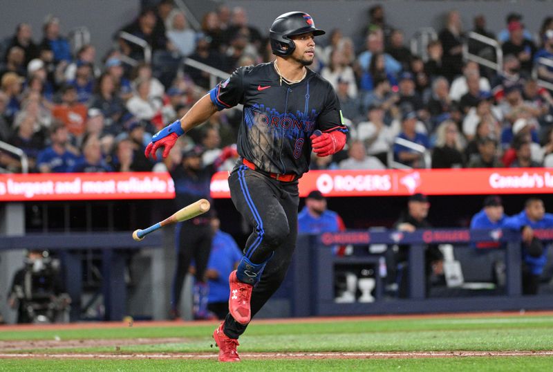 Sep 25, 2024; Toronto, Ontario, CAN;  Toronto Blue Jays center fielder Jonatan Clase (8) hits a two-run home run against the Boston Red Sox in the seventh inning at Rogers Centre. Mandatory Credit: Dan Hamilton-Imagn Images