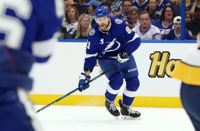 Oct 28, 2024; Tampa, Florida, USA; Tampa Bay Lightning defenseman Erik Cernak (81) skates with the puck against the Nashville Predators during the first period at Amalie Arena. Mandatory Credit: Kim Klement Neitzel-Imagn Images