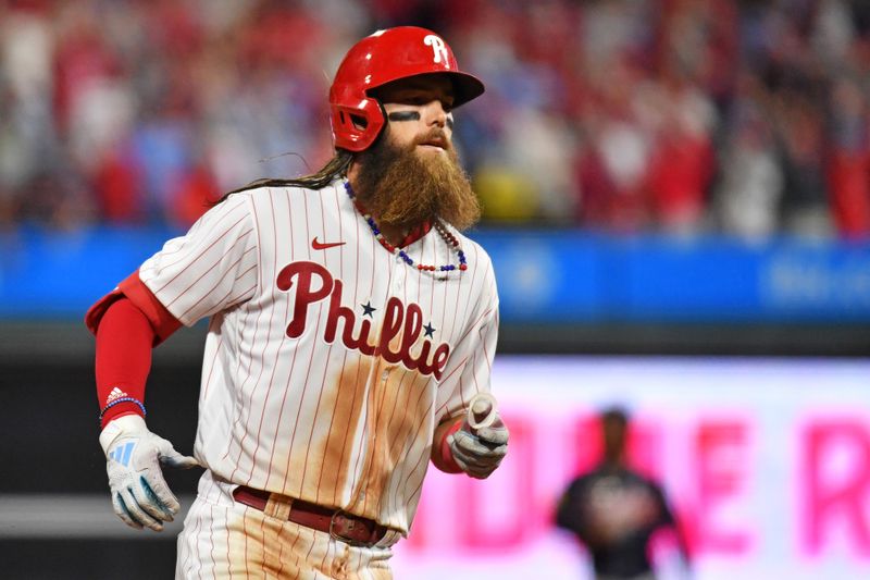 Oct 11, 2023; Philadelphia, Pennsylvania, USA; Philadelphia Phillies left fielder Brandon Marsh (16) hits a solo home run during the eighth inning against the Atlanta Braves in game three of the NLDS for the 2023 MLB playoffs at Citizens Bank Park. Mandatory Credit: Eric Hartline-USA TODAY Sports