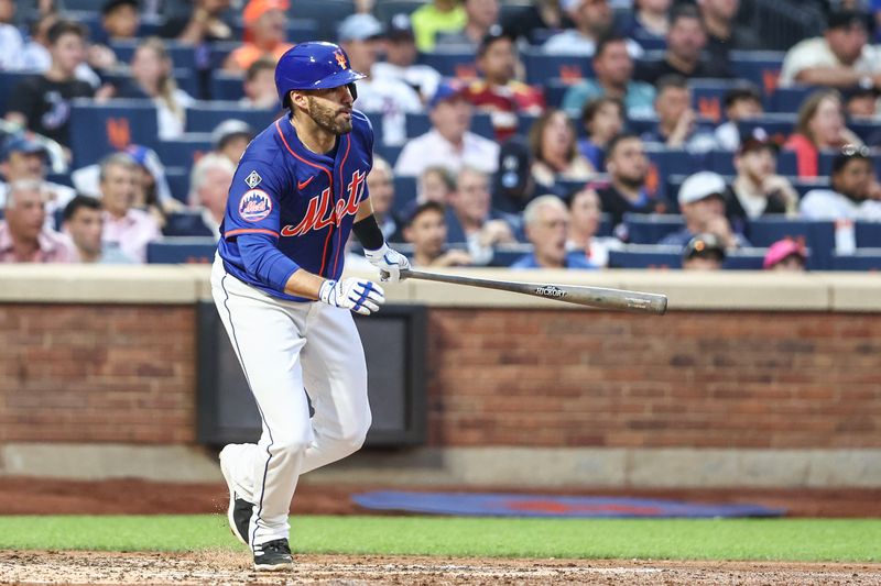 Jun 26, 2024; New York City, New York, USA;  New York Mets designated hitter J.D. Martinez (28) hits an RBI single in the third inning against the New York Yankees at Citi Field. Mandatory Credit: Wendell Cruz-USA TODAY Sports