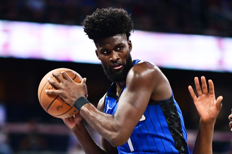 ORLANDO, FLORIDA - NOVEMBER 12: Jonathan Isaac #1 of the Orlando Magic grabs a defensive rebound in the first half against the Charlotte Hornets during an Emirates NBA Cup game at Kia Center on November 12, 2024 in Orlando, Florida. NOTE TO USER: User expressly acknowledges and agrees that, by downloading and or using this photograph, User is consenting to the terms and conditions of the Getty Images License Agreement. (Photo by Julio Aguilar/Getty Images)