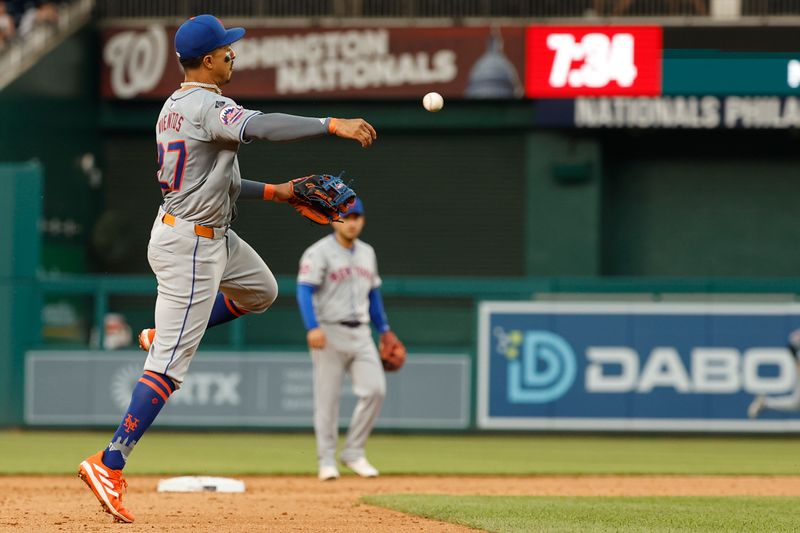 Jun 5, 2024; Washington, District of Columbia, USA; New York Mets third baseman Mark Vientos (27) ,makes a throw to first base on a ground ball by Washington Nationals outfielder Lane Thomas (not pictured) during the ninth inning at Nationals Park. Mandatory Credit: Geoff Burke-USA TODAY Sports