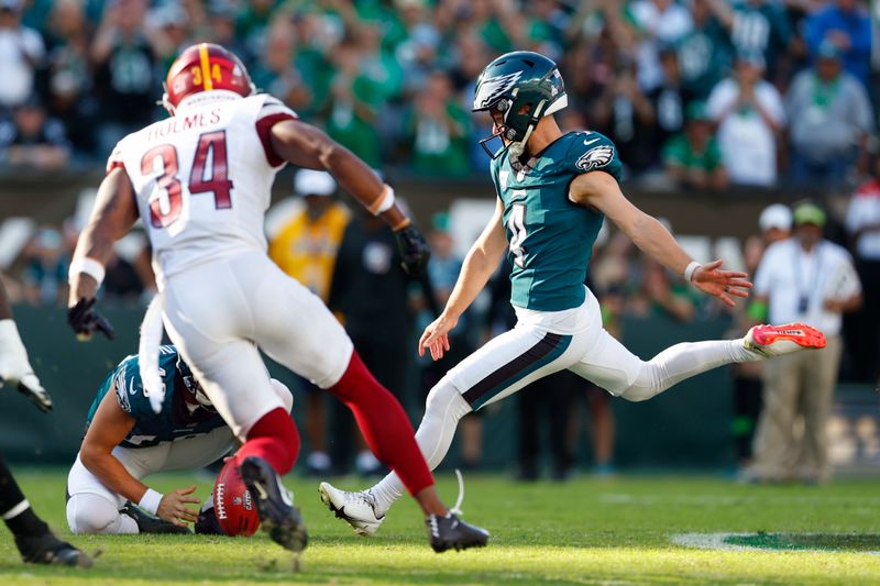 Philadelphia Eagles place kicker Jake Elliott (4) kicks the game winning field goal in overtime to defeat the Washington Commanders 34-31 during an NFL football game, Sunday, Oct. 1, 2023, in Philadelphia. (AP Photo/Rich Schultz)