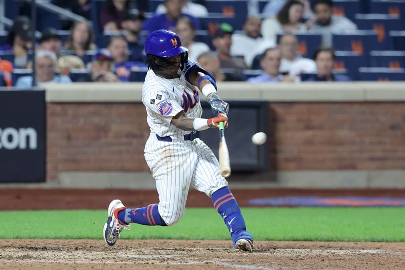 Sep 17, 2024; New York City, New York, USA; New York Mets shortstop Luisangel Acuna (2) hits a solo home run against the Washington Nationals during the eighth inning at Citi Field. The home run was the first of his major league career. Mandatory Credit: Brad Penner-Imagn Images