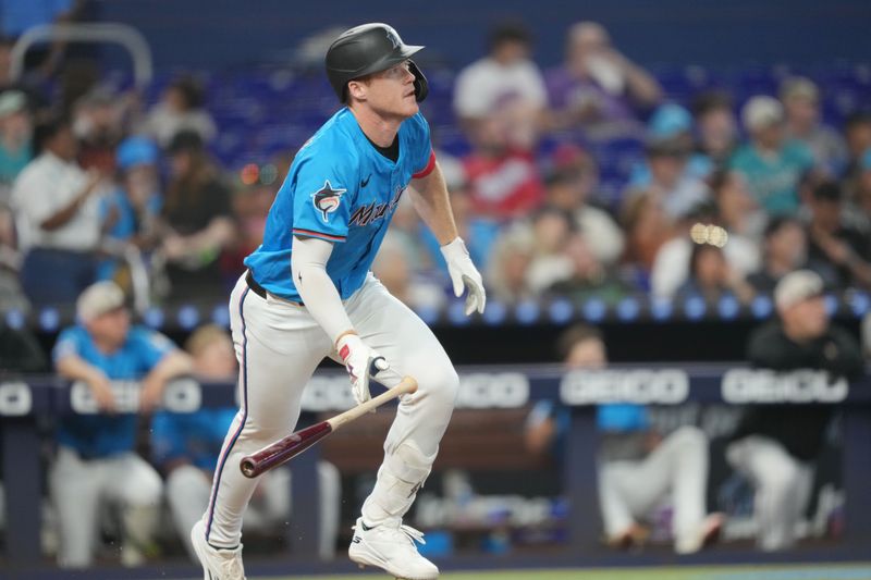May 18, 2025; Miami, Florida, USA;  Miami Marlins left fielder Eric Wagaman (33) hits a double in the second inning against the Tampa Bay Rays at loanDepot Park. Mandatory Credit: Jim Rassol-Imagn Images