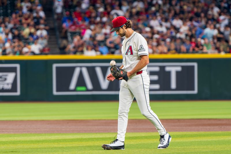 Sep 15, 2024; Phoenix, Arizona, USA; Arizona Diamondbacks starting pitcher Zac Gallen (23) reacts between pitching during the first inning of a game against the Milwaukee Brewers at Chase Field. Mandatory Credit: Allan Henry-USA TODAY Sports