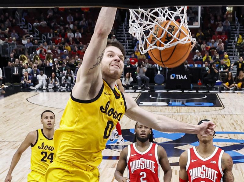 Mar 9, 2023; Chicago, IL, USA; Iowa Hawkeyes forward Filip Rebraca (0) scores against the Ohio State Buckeyes during the first half at United Center. Mandatory Credit: Kamil Krzaczynski-USA TODAY Sports