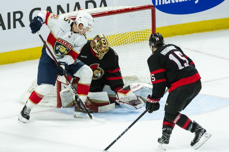 Apr 5, 2025; Ottawa, Ontario, CAN; Ottawa Senators goalie Anton Forsberg (31) makes a save in front of Florida Panthers center Anton Lundell (15) in the third period at the Canadian Tire Centre. Mandatory Credit: Marc DesRosiers-Imagn Images