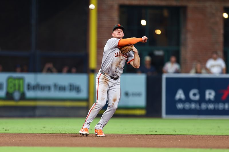 Sep 7, 2024; San Diego, California, USA; San Francisco Giants third baseman Matt Chapman (26) fields a ground ball from San Diego Padres second baseman Xander Bogaerts (not pictured) to end the fifth inning at Petco Park. Mandatory Credit: Chadd Cady-Imagn Images