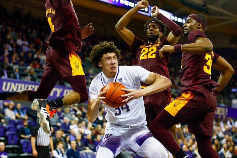 Jan 26, 2023; Seattle, Washington, USA; Washington Huskies center Braxton Meah (34) pump fakes against Arizona State Sun Devils guard Desmond Cambridge Jr. (4), forward Warren Washington (22) and guard Devan Cambridge (35) during the first half at Alaska Airlines Arena at Hec Edmundson Pavilion. Mandatory Credit: Joe Nicholson-USA TODAY Sports