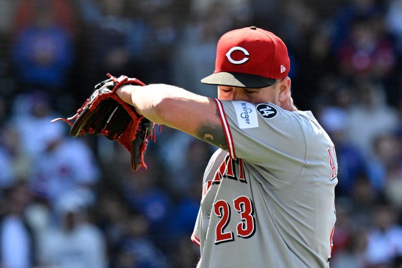 May 31, 2025; Chicago, Illinois, USA;  Cincinnati Reds pitcher Graham Ashcraft (23) reacts after the Chicago Cubs score during the eighth inning at Wrigley Field. Mandatory Credit: Matt Marton-Imagn Images