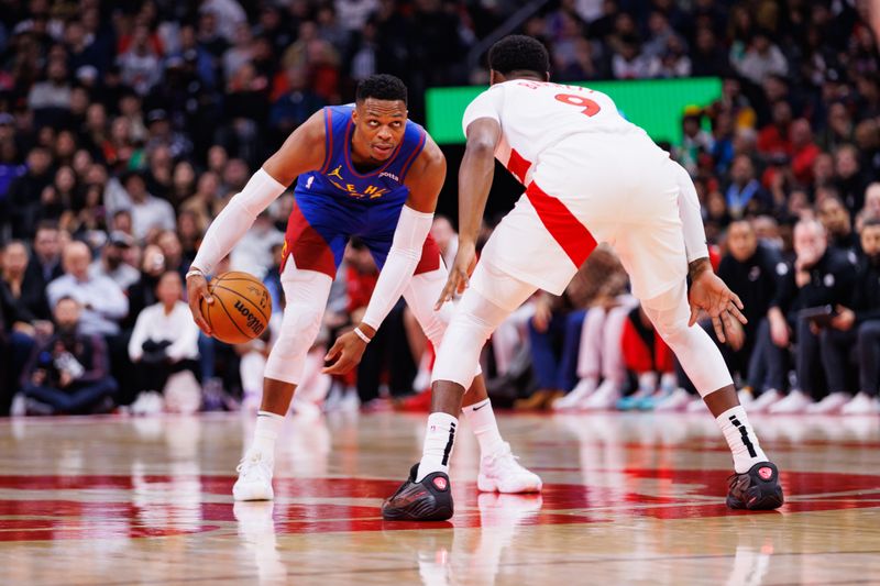 TORONTO, CANADA - OCTOBER 28: Russell Westbrook #4 of the Denver Nuggets dribbles against RJ Barrett #9 of the Toronto Raptors during the first half of their NBA game at Scotiabank Arena on October 28, 2024 in Toronto, Ontario, Canada. NOTE TO USER: User expressly acknowledges and agrees that, by downloading and or using this photograph, User is consenting to the terms and conditions of the Getty Images License Agreement. (Photo by Cole Burston/Getty Images)