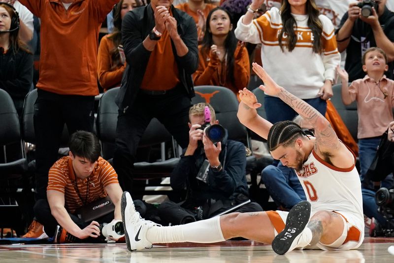 Feb 18, 2023; Austin, Texas, USA; Texas Longhorns forward Timmy Allen (0) reacts after drawing a foul while scoring during the second half against the Oklahoma Sooners at Moody Center. Mandatory Credit: Scott Wachter-USA TODAY Sports