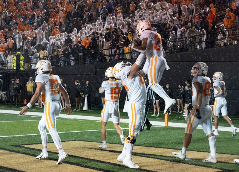 Nov 26, 2022; Nashville, Tennessee, USA;   Tennessee Volunteers running back Dylan Sampson (24) celebrates with offensive lineman Parker Ball (65) after scoring a touchdown against the Vanderbilt Commodores during the fourth quarter at FirstBank Stadium.  Mandatory Credit: George Walker IV - USA TODAY Sports