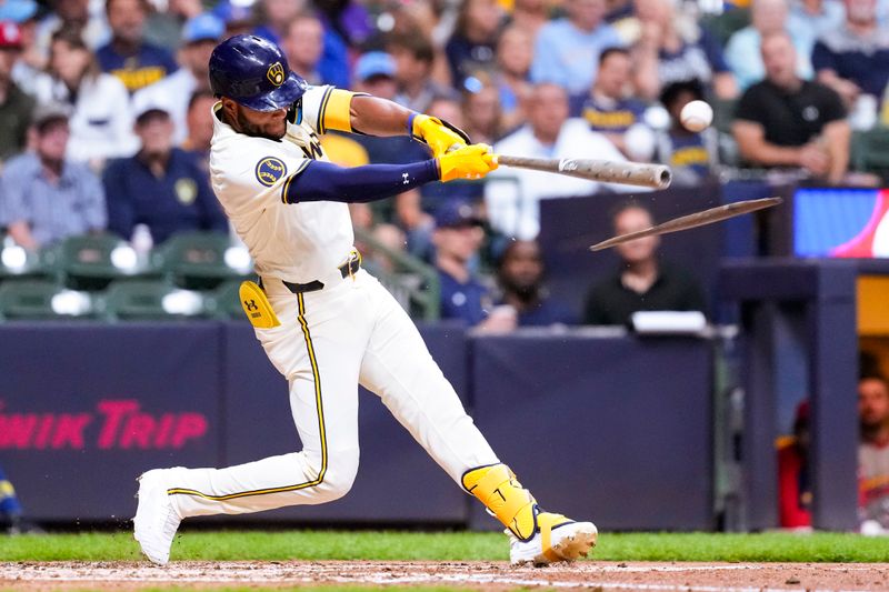 Sep 4, 2024; Milwaukee, Wisconsin, USA;  Milwaukee Brewers designated hitter Jackson Chourio (11) breaks his bat while hitting a double during the fourth inning against the St. Louis Cardinals at American Family Field. Mandatory Credit: Jeff Hanisch-Imagn Images