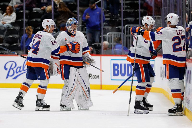 Oct 14, 2024; Denver, Colorado, USA; New York Islanders goaltender Ilya Sorokin (30) and center Bo Horvat (14) and defenseman Ryan Pulock (6) and left wing Anders Lee (27) celebrate after the game against the Colorado Avalanche at Ball Arena. Mandatory Credit: Isaiah J. Downing-Imagn Images