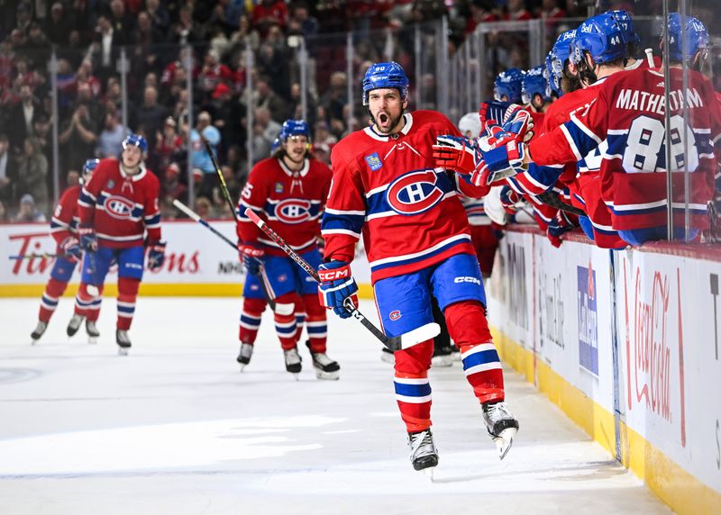 Mar 9, 2023; Montreal, Quebec, CAN; Montreal Canadiens right wing Alex Belzile (60) celebrates his goal against the New York Rangers with his teammates at the bench during the first period at Bell Centre. Mandatory Credit: David Kirouac-USA TODAY Sports