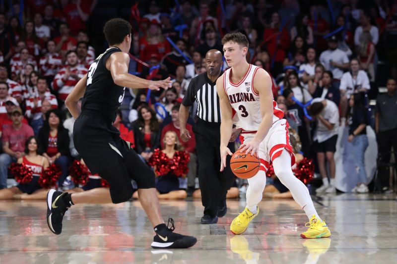 Feb 18, 2023; Tucson, Arizona, USA; Arizona Wildcats guard Pelle Larsson (3) dribbles down the court against Colorado Buffaloes guard Nique Clifford (32) during the second half at McKale Center. Mandatory Credit: Zachary BonDurant-USA TODAY Sports