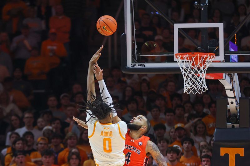 Feb 28, 2024; Knoxville, Tennessee, USA; Tennessee Volunteers forward Jonas Aidoo (0) shoots the ball against Auburn Tigers forward Johni Broome (4) during the first half at Thompson-Boling Arena at Food City Center. Mandatory Credit: Randy Sartin-USA TODAY Sports