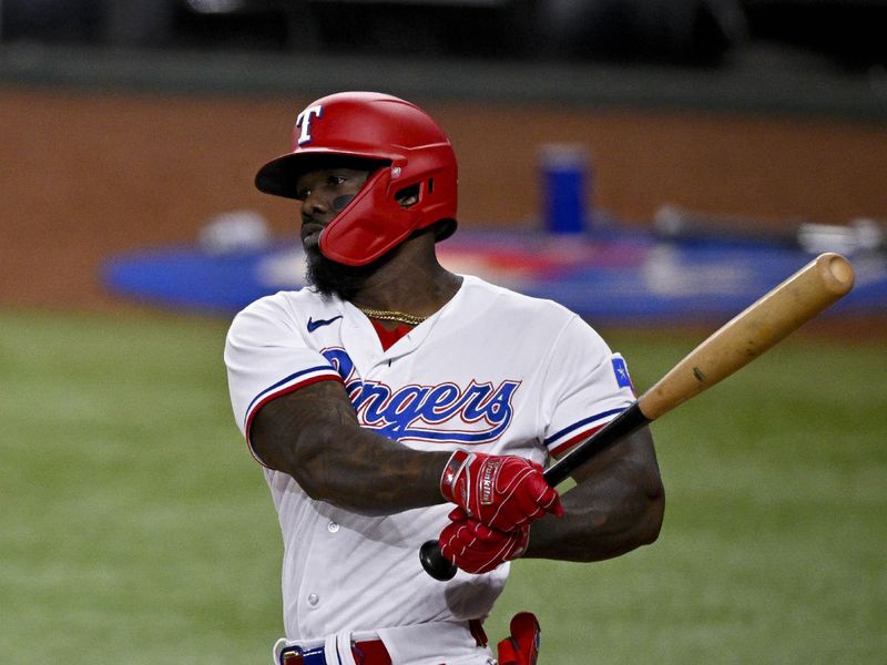 May 16, 2023; Arlington, Texas, USA; Texas Rangers right fielder Adolis Garcia (53) bats against the Atlanta Braves during the seventh inning at Globe Life Field. Mandatory Credit: Jerome Miron-USA TODAY Sports