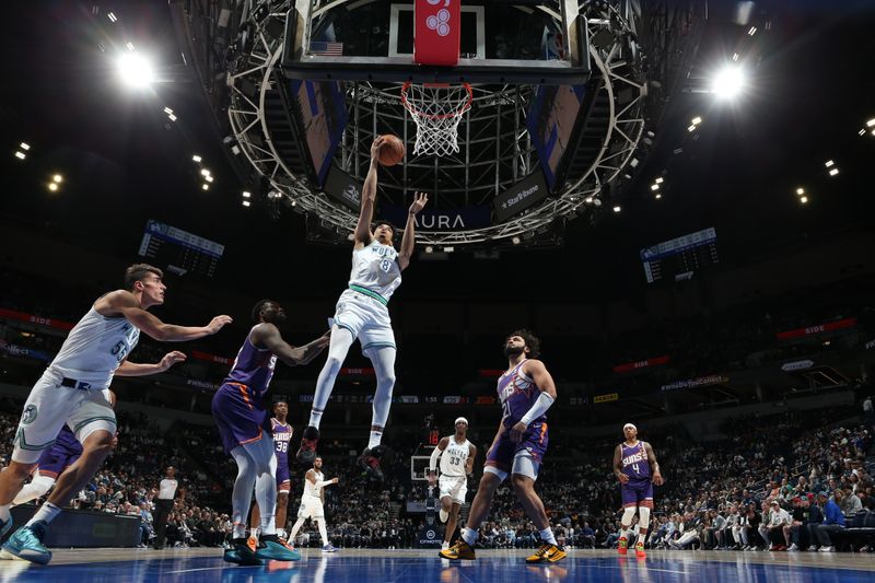 MINNEAPOLIS, MN -  APRIL 14: Josh Minott #8 of the Minnesota Timberwolves drives to the basket during the game against the Phoenix Suns on April 14, 2024 at Target Center in Minneapolis, Minnesota. NOTE TO USER: User expressly acknowledges and agrees that, by downloading and or using this Photograph, user is consenting to the terms and conditions of the Getty Images License Agreement. Mandatory Copyright Notice: Copyright 2024 NBAE (Photo by David Sherman/NBAE via Getty Images)