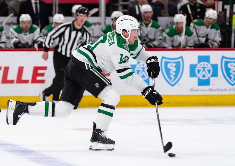 Apr 6, 2024; Chicago, Illinois, USA; Dallas Stars center Ty Dellandrea (10) moves the puck during the first period at United Center. Mandatory Credit: Seeger Gray-USA TODAY Sports