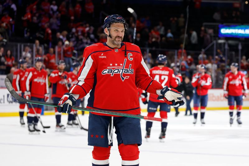 Nov 5, 2025; Washington, District of Columbia, USA; Washington Capitals left wing Alex Ovechkin (8) gestures to his son Sergei (not pictured) after the Capitals' game against the St. Louis Blues, where he scored his 900th NHL goal at Capital One Arena. Mandatory Credit: Geoff Burke-Imagn Images