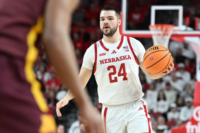 Mar 1, 2025; Lincoln, Nebraska, USA;  Nebraska Cornhuskers guard Rollie Worster (24) dribbles against the Minnesota Golden Gophers during the first half at Pinnacle Bank Arena. Mandatory Credit: Steven Branscombe-Imagn Images