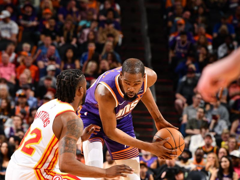 PHOENIX, AZ - MARCH 21:  Kevin Durant #35 of the Phoenix Suns handles the ball during the game  on March 21, 2024 at Footprint Center in Phoenix, Arizona. NOTE TO USER: User expressly acknowledges and agrees that, by downloading and or using this photograph, user is consenting to the terms and conditions of the Getty Images License Agreement. Mandatory Copyright Notice: Copyright 2024 NBAE (Photo by Barry Gossage/NBAE via Getty Images)