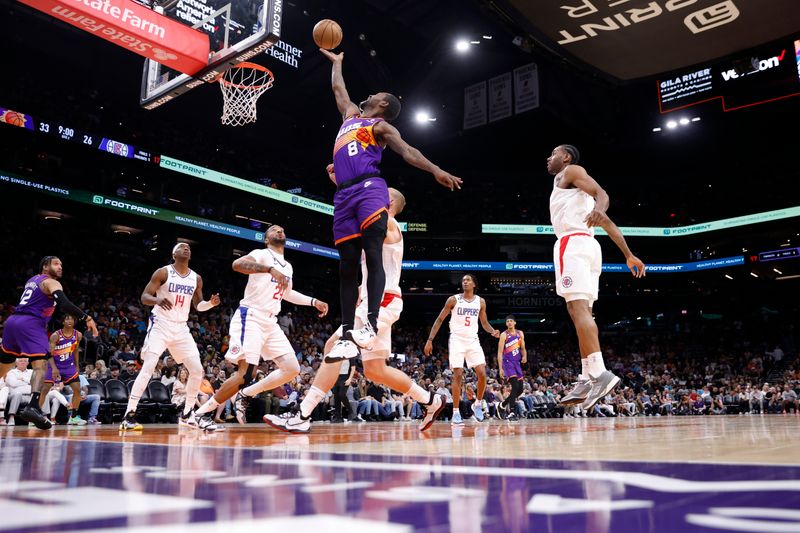 PHOENIX, ARIZONA - APRIL 09: Terrence Ross #8 of the Phoenix Suns attempts a layup during the first half of the game against the Los Angeles Clippers at Footprint Center on April 09, 2023 in Phoenix, Arizona. NOTE TO USER: User expressly acknowledges and agrees that, by downloading and or using this photograph, User is consenting to the terms and conditions of the Getty Images License Agreement.  (Photo by Chris Coduto/Getty Images)