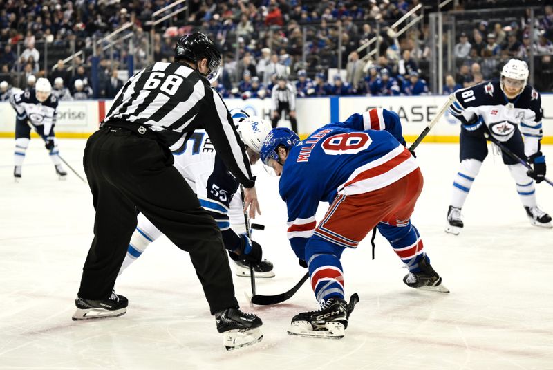 Mar 22, 2026; New York, New York, USA; Winnipeg Jets center Mark Scheifele (55) faces off against New York Rangers center J.T. Miller (8) during the first period at Madison Square Garden. Mandatory Credit: John Jones-Imagn Images