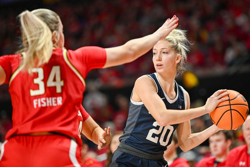 Feb 18, 2024; College Park, Maryland, USA;  Penn State Nittany Lions guard Makenna Marisa (20) looks to pass as Maryland Terrapins guard Emily Fisher (34) defends during the first half at Xfinity Center. Mandatory Credit: Tommy Gilligan-USA TODAY Sports