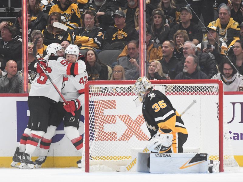 Nov 16, 2023; Pittsburgh, Pennsylvania, USA; New Jersey Devils center Curtis Lazar (42) celebrates a short handed goal with left wing Erik Haula (56) after scoring on Pittsburgh Penguins goalie Tristan Jarry (35) during the first period at PPG Paints Arena. Mandatory Credit: Philip G. Pavely-USA TODAY Sports