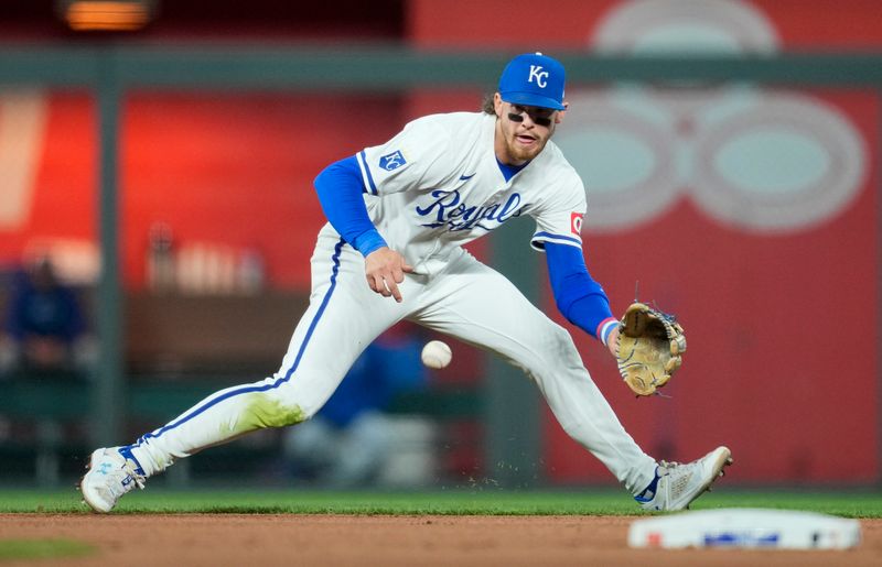 Apr 22, 2024; Kansas City, Missouri, USA; Kansas City Royals shortstop Bobby Witt Jr. (7) fields a ground ball during the seventh inning against the Toronto Blue Jays at Kauffman Stadium. Mandatory Credit: Jay Biggerstaff-USA TODAY Sports