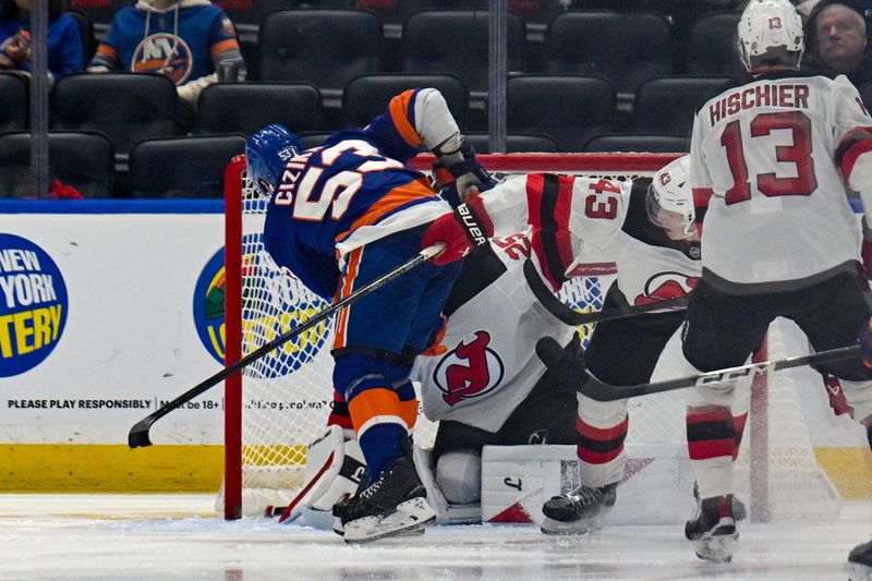 Jan 6, 2026; Elmont, New York, USA;  New York Islanders center Casey Cizikas (53) scores a goal past New Jersey Devils goaltender Jacob Markstrom (25) during the third period at UBS Arena. Mandatory Credit: Dennis Schneidler-Imagn Images