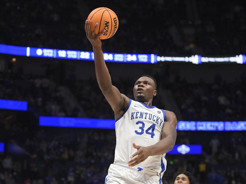 Mar 10, 2023; Nashville, TN, USA; Kentucky Wildcats forward Oscar Tshiebwe (34) lays the ball in against the Kentucky Wildcats during the second half at Bridgestone Arena. Mandatory Credit: Steve Roberts-USA TODAY Sports