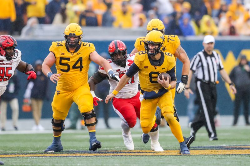 Sep 23, 2023; Morgantown, West Virginia, USA; West Virginia Mountaineers quarterback Nicco Marchiol (8) runs the ball against the Texas Tech Red Raiders during the third quarter at Mountaineer Field at Milan Puskar Stadium. Mandatory Credit: Ben Queen-USA TODAY Sports