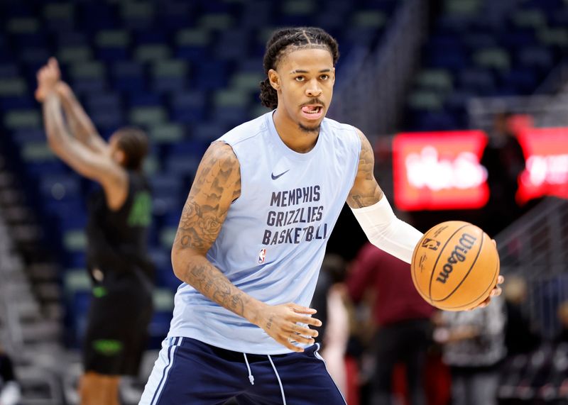 NEW ORLEANS, LOUISIANA - DECEMBER 19: Ja Morant #12 of the Memphis Grizzlies warms up prior to playing the New Orleans Pelicans at Smoothie King Center on December 19, 2023 in New Orleans, Louisiana.  NOTE TO USER: User expressly acknowledges and agrees that, by downloading and or using this photograph, User is consenting to the terms and conditions of the Getty Images License Agreement. (Photo by Chris Graythen/Getty Images)