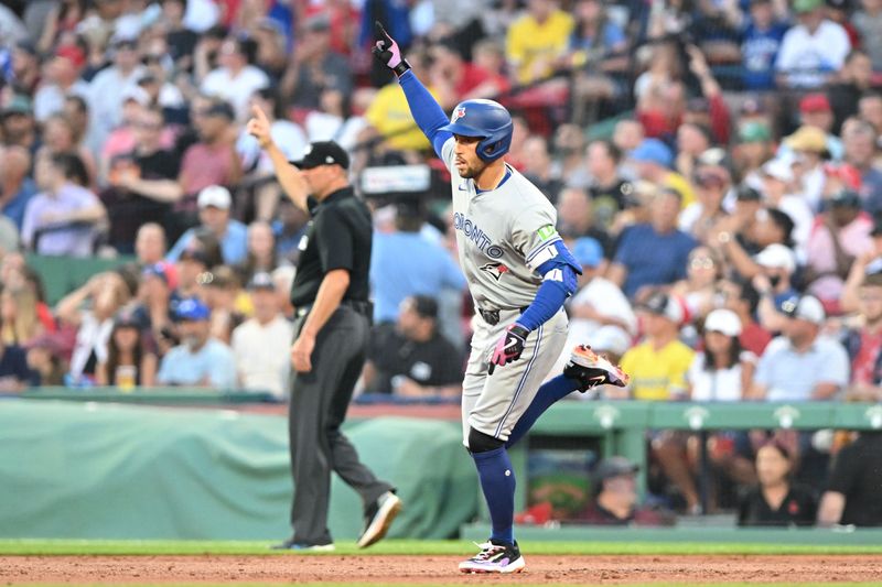 Jun 25, 2024; Boston, Massachusetts, USA; Toronto Blue Jays right fielder George Springer (4) reacts after hitting a two-run home run against the Boston Red Sox during the third inning at Fenway Park. Mandatory Credit: Brian Fluharty-USA TODAY Sports