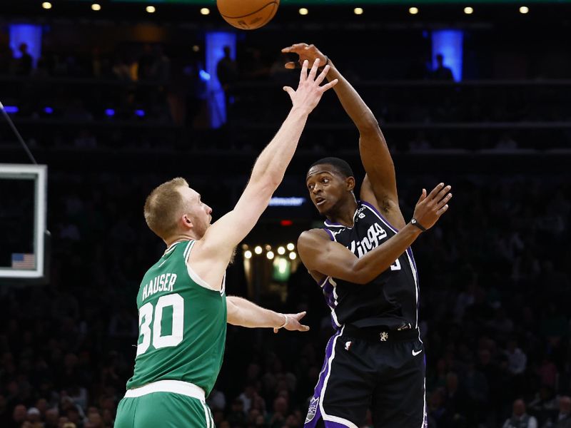 BOSTON, MA - APRIL 5: De'Aaron Fox #5 of the Sacramento Kings throws a pass over Sam Hauser #30 of the Boston Celtics during the second half at TD Garden on April 5, 2024 in Boston, Massachusetts. NOTE TO USER: User expressly acknowledges and agrees that, by downloading and/or using this Photograph, user is consenting to the terms and conditions of the Getty Images License Agreement. (Photo By Winslow Townson/Getty Images)