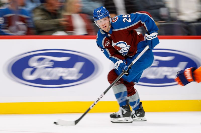 Oct 14, 2024; Denver, Colorado, USA; Colorado Avalanche right wing Logan O'Connor (25) controls the puck in the second period against the New York Islanders at Ball Arena. Mandatory Credit: Isaiah J. Downing-Imagn Images