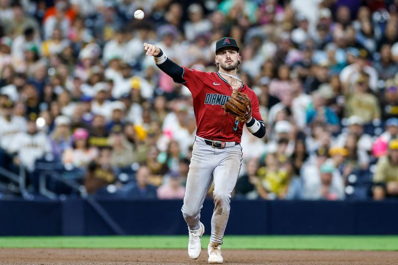 Sep 26, 2025; San Diego, California, USA; Arizona Diamondbacks third baseman Blaze Alexander (9) throws to first base for an out during the seventh inning against the San Diego Padres at Petco Park. Mandatory Credit: David Frerker-Imagn Images