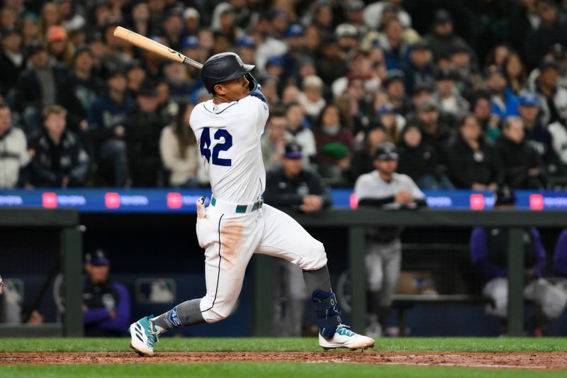 Apr 15, 2023; Seattle, Washington, USA; Seattle Mariners shortstop J.P. Crawford (3) turns the double play with Colorado Rockies third baseman Elehuris Montero (44) out at second base during the second inning at T-Mobile Park. Mandatory Credit: Steven Bisig-USA TODAY Sports