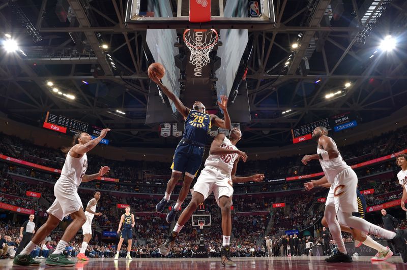 CLEVELAND, OH - APRIL 13:  Quenton Jackson #29 of the Indiana Pacers drives to the basket during the game against the Cleveland Cavaliers on April 13, 2025 at Rocket Arena in Cleveland, Ohio. NOTE TO USER: User expressly acknowledges and agrees that, by downloading and/or using this Photograph, user is consenting to the terms and conditions of the Getty Images License Agreement. Mandatory Copyright Notice: Copyright 2025 NBAE (Photo by David Liam Kyle/NBAE via Getty Images)