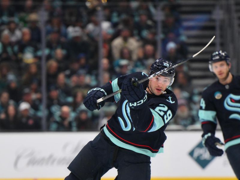 Nov 22, 2023; Seattle, Washington, USA; Seattle Kraken defenseman Vince Dunn (29) passes the puck against the San Jose Sharks during the second period at Climate Pledge Arena. Mandatory Credit: Steven Bisig-USA TODAY Sports