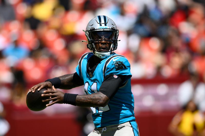 Carolina Panthers quarterback PJ Walker (11) in action during the first half of a preseason NFL football game against the Washington Commanders, Saturday, Aug. 13, 2022, in Landover, Md. (AP Photo/Nick Wass)