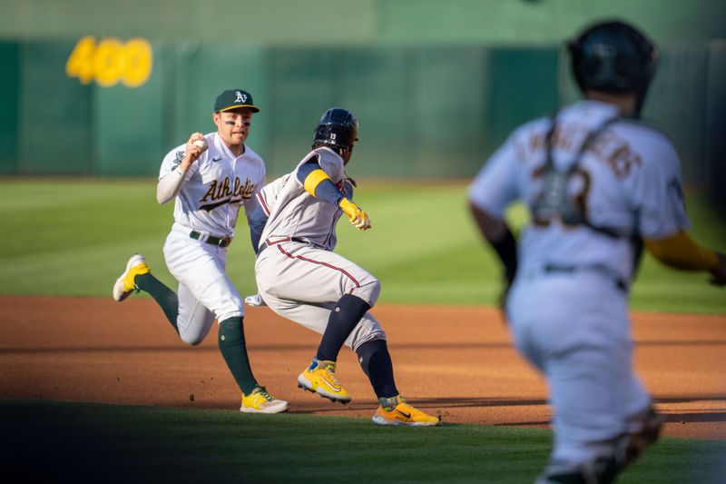 May 30, 2023; Oakland, California, USA;  Atlanta Braves right fielder Ronald Acuna Jr. (13) caught stealing second base by Oakland Athletics shortstop Nick Allen (2) during the first inning at Oakland-Alameda County Coliseum. Mandatory Credit: Neville E. Guard-USA TODAY Sports