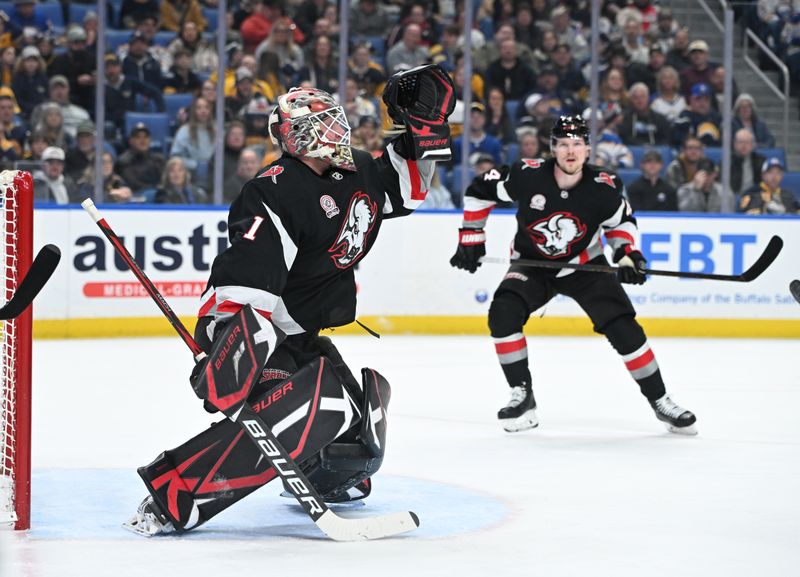 Jan 31, 2025; Buffalo, New York, USA; Buffalo Sabres goaltender Ukko-Pekka Luukkonen (1) reaches for a puck shot on goal by the Nashville Predators in the first period at the KeyBank Center. Mandatory Credit: Mark Konezny-Imagn Images